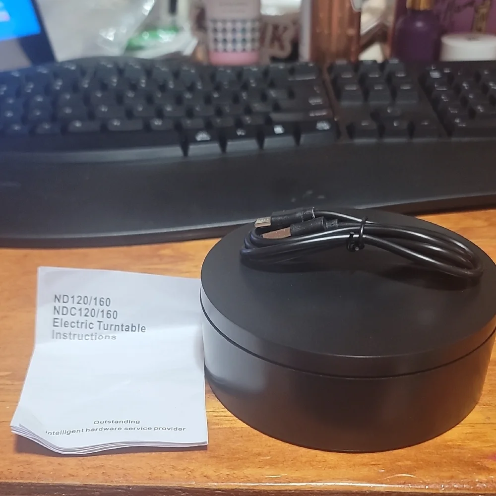 Sleek Black Rotating Display Stand